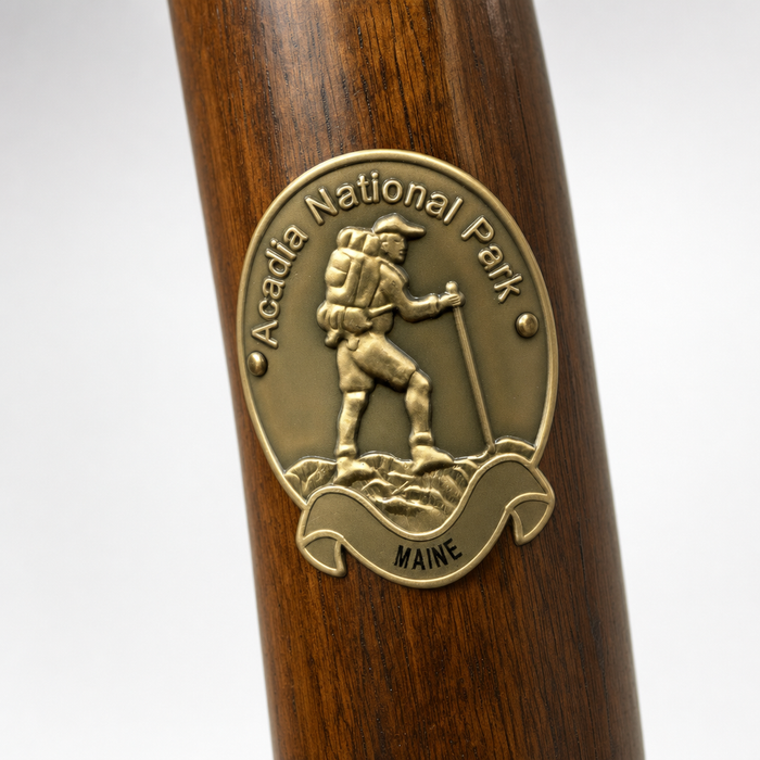 Acadia National Park hiking stick medallion installed on a wooden hiking staff