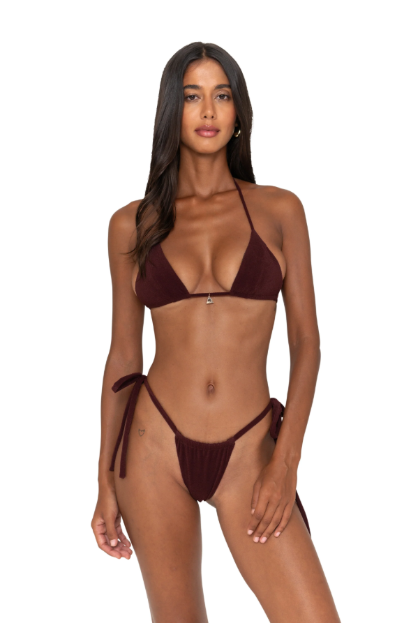Woman wearing a burgundy bikini on a white background