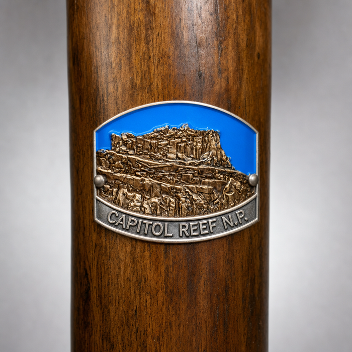 Capitol Reef National Park hiking stick medallion installed on a wooden hiking staff