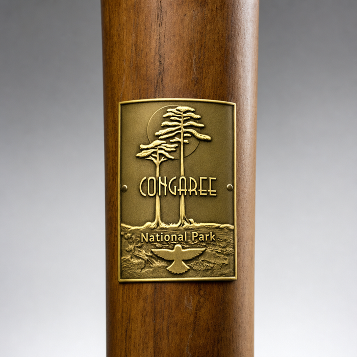 Congaree National Park hiking stick medallion installed on a wooden hiking staff