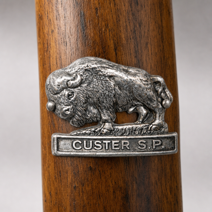 Custer State Park hiking stick medallion installed on a wooden hiking staff