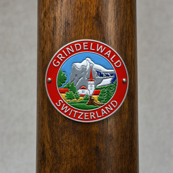 Grindelwald _ Switzerland hiking stick medallion installed on a wooden hiking staff