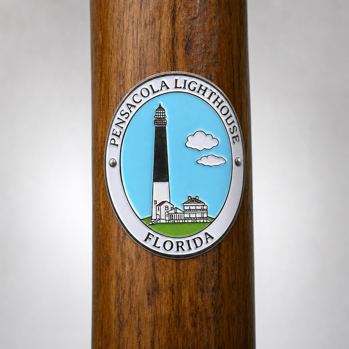 Pensacola Lighthouse hiking stick medallion installed on a wooden hiking staff